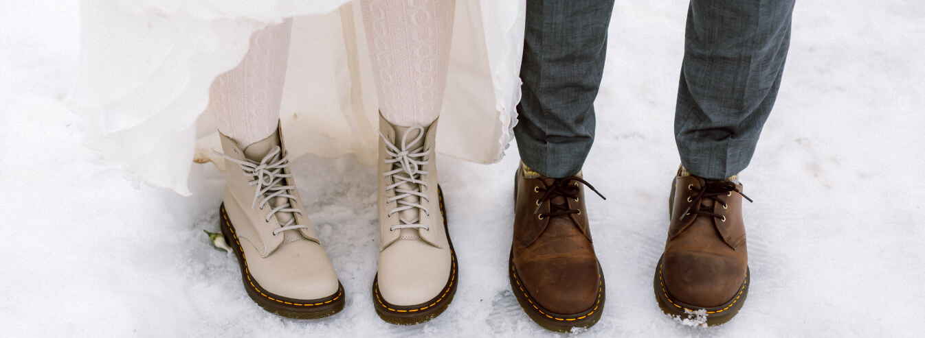 boots and snow at winter wedding venue in essex
