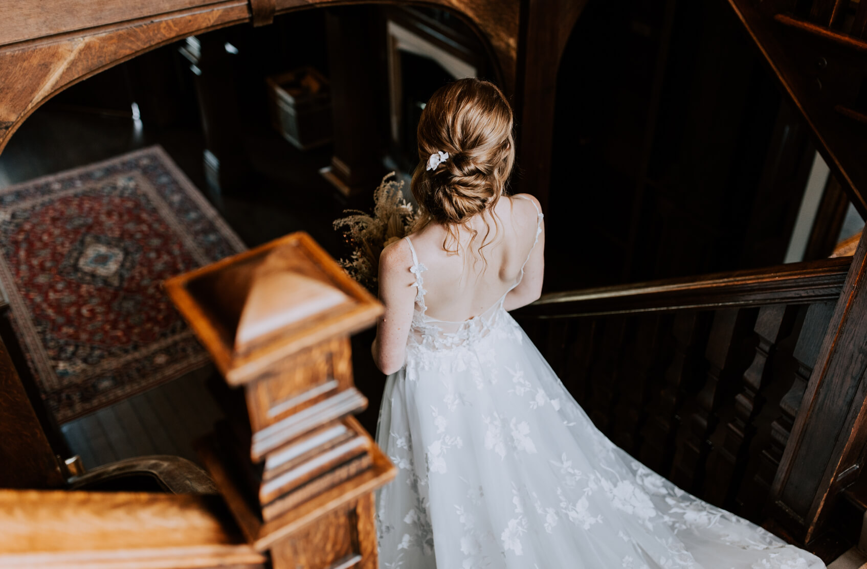 bride on stairs at wedding venue in essex
