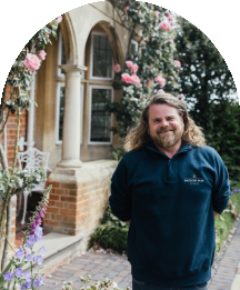 Baddow Park House team member standing by venue gardens
