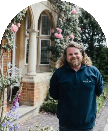 Baddow Park House team member standing by venue gardens