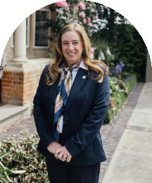 Wedding coordinator smiling outside Baddow Park House