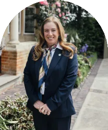Wedding coordinator smiling outside Baddow Park House