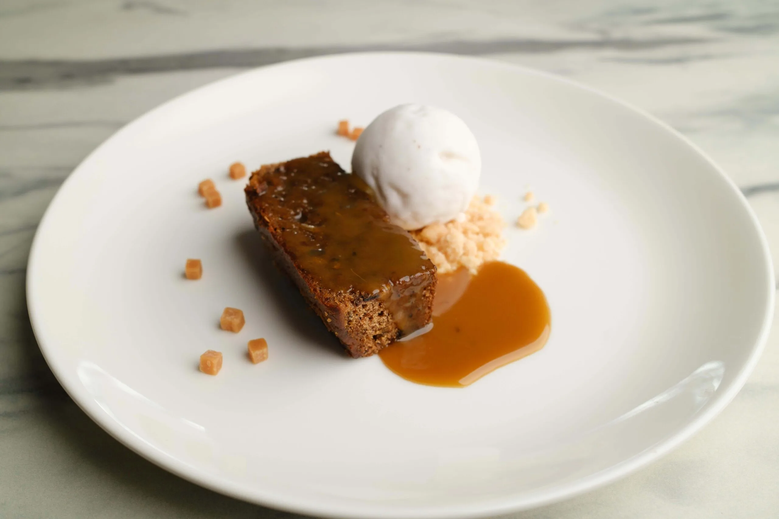 Stem ginger & date sponge, toffee sauce, salted caramel ice cream